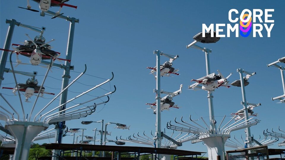 A delivery drone lifting off with a package